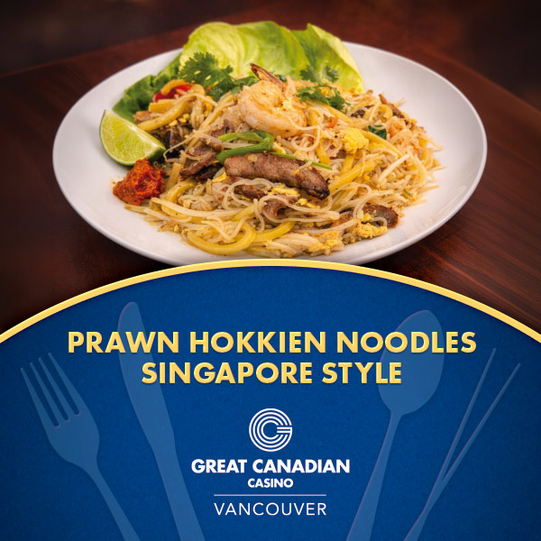 A plate of prawn Hokkien noodles Singapore style, garnished with prawns, vegetables, and a lime wedge, sits on a wooden table above text promoting £9.99 All You Can Eat Pasta at Great Canadian Casino Vancouver.