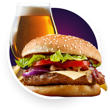 A cheeseburger with lettuce, tomato, red onion, bacon, and cheese on a sesame seed bun sits in front of a glass of beer—perfect fuel before a night of poker at Great Canadian Casino Vancouver.