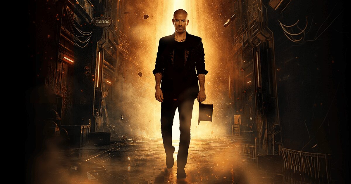 A man in dark clothing walks confidently down a dramatic, dimly lit alleyway, with golden light and debris around him. He holds a briefcase and looks determined, while the background features urban, industrial details.